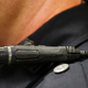 A police officer shows off a newly deployed body camera attached to his shirt collar on March 2, 2015, in West Valley City, Utah.
George Frey/Getty Images